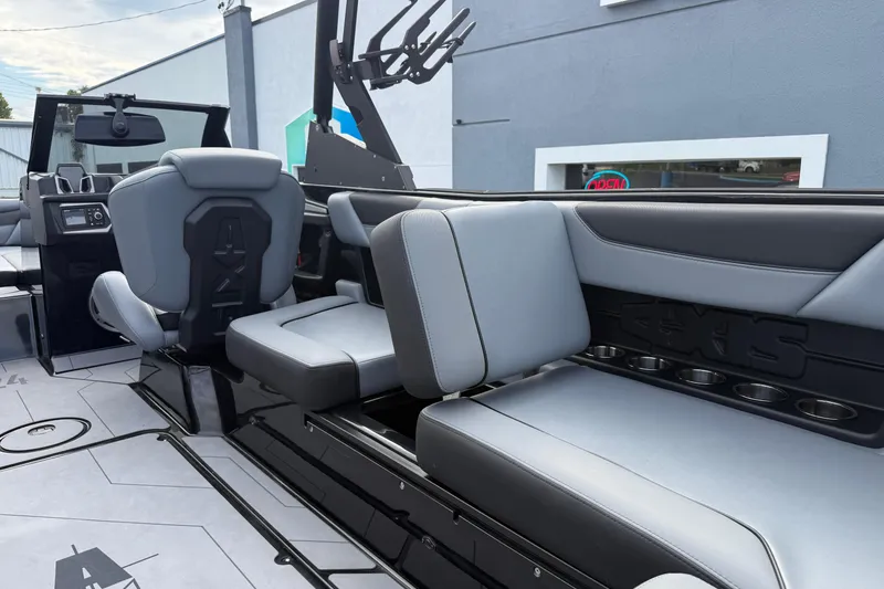 Slide: The Image of 2022 Axis A24 boat interior with sleek gray seating and modern design. - 22