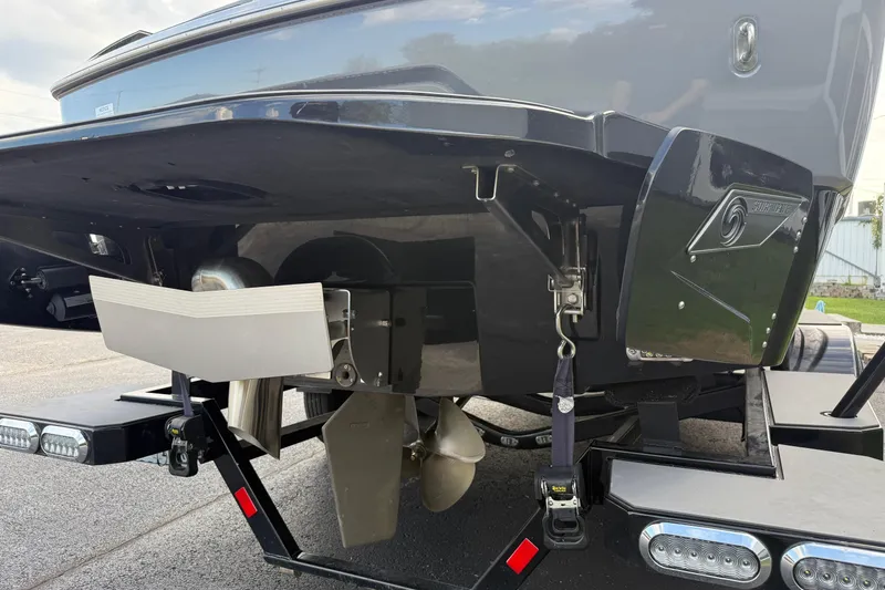 Slide: The Image of 2022 Axis A24 boat stern with propeller and trailer details. - 5