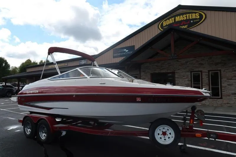 Slide: The Image of 2007 Glastron GLX 205 boat on trailer outside Boat Masters store. - 4