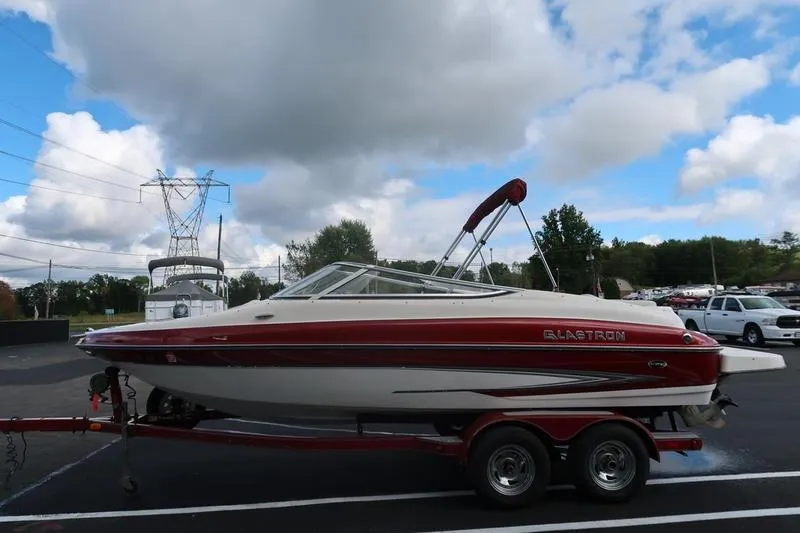 Slide: The Image of 2007 Glastron GLX 205 boat on trailer under cloudy sky. - 6