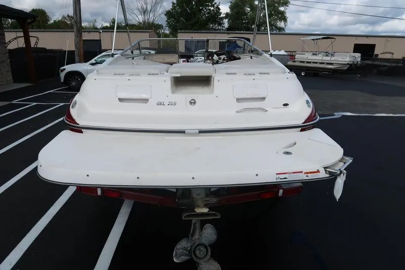 Slide: The Image of 2007 Glastron GLX 205 boat rear view in a parking lot. - 8