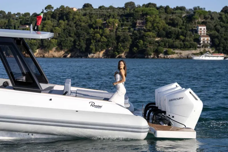 Slide: The Image of 2026 Ranieri CAYMAN 50 HARDTOP yacht with Mercury engines on scenic water. - 34