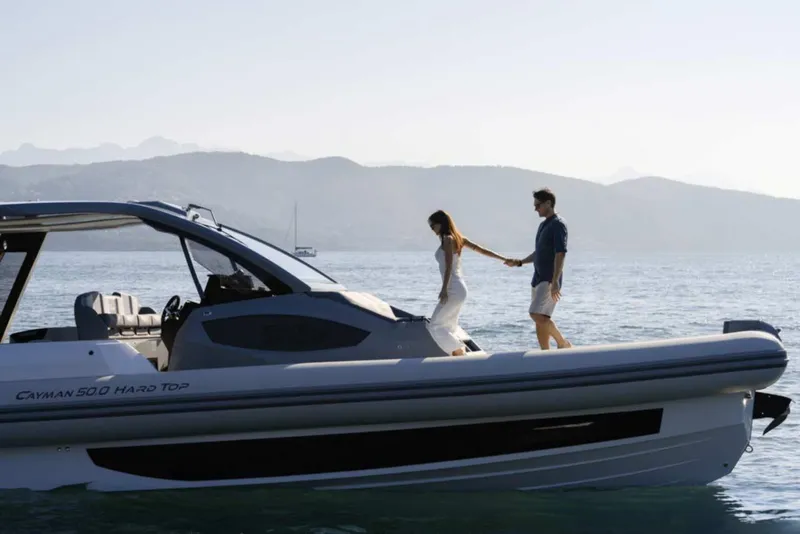 Slide: The Image of Couple on 2026 Ranieri CAYMAN 50 HARDTOP yacht, enjoying a serene sea view. - 7