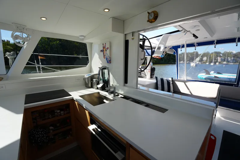 Slide: The Image of Modern kitchen interior on 2024 Balance 442 yacht with scenic water view. - 13