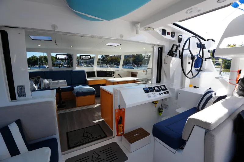 Slide: The Image of 2024 Balance 442 yacht interior with modern design, spacious seating, and navigation controls. - 14