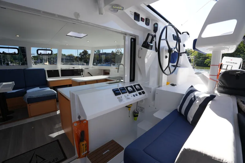 Slide: The Image of Modern interior of 2024 Balance 442 yacht with steering wheel and seating area. - 16