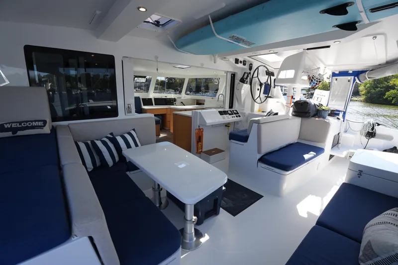 Slide: The Image of Luxurious interior of 2024 Balance 442 catamaran with modern seating and navigation area. - 19