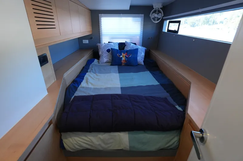 Slide: The Image of Cozy bedroom in 2024 Balance 442 yacht with modern design and colorful bedding. - 22