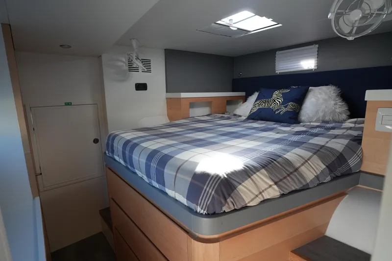 Slide: The Image of 2024 Balance 442 interior with cozy bed, plaid bedding, and modern design elements. - 25