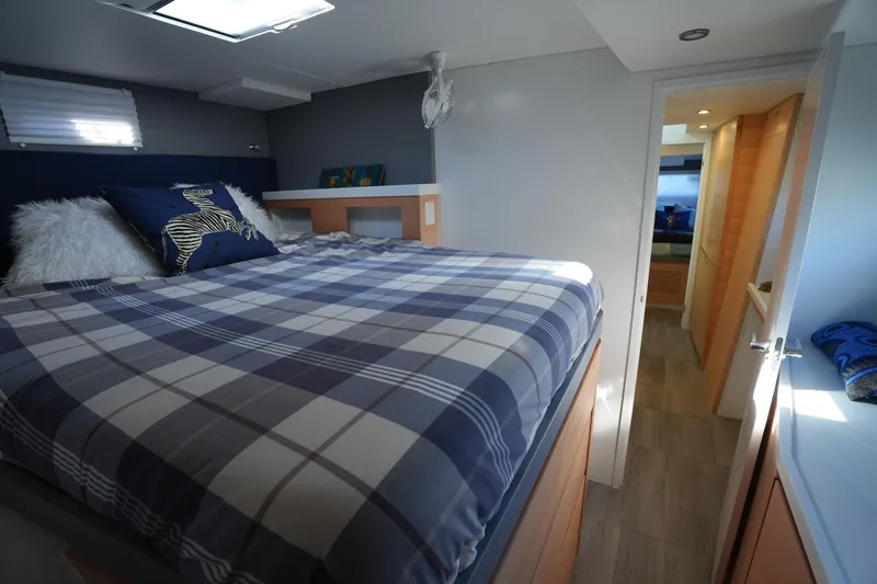Slide: The Image of Cozy bedroom in 2024 Balance 442 yacht with plaid bedding and modern decor. - 26
