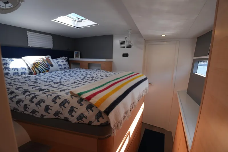 Slide: The Image of Cozy bedroom in 2024 Balance 442 yacht with skylight and colorful bedding. - 28