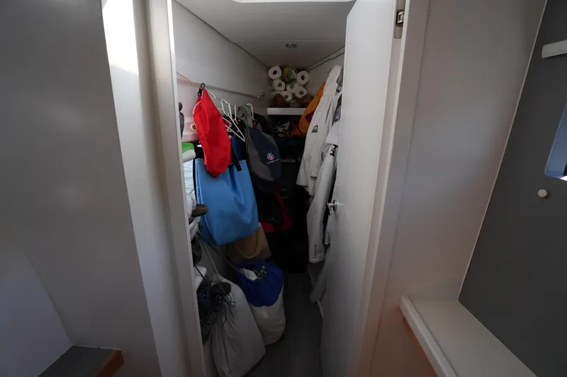 Slide: The Image of Narrow storage space on Balance 442 yacht, filled with clothes and supplies, 2024 model. - 29