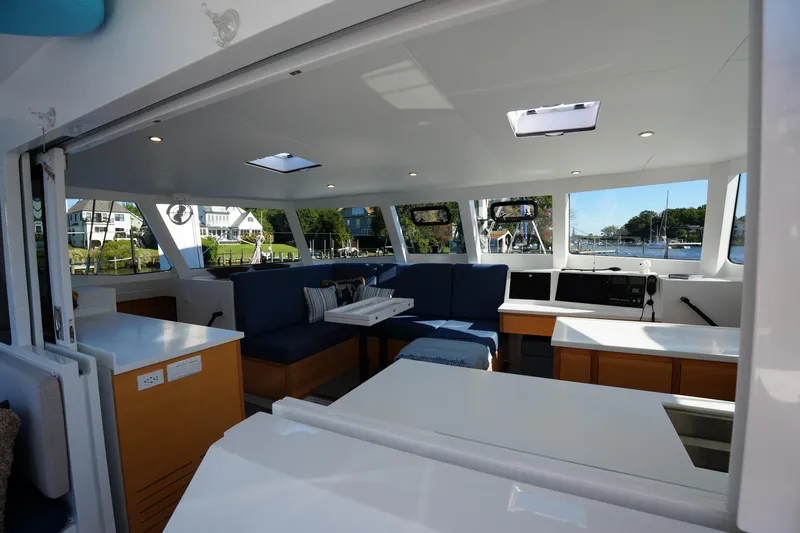 Slide: The Image of Luxurious interior of 2024 Balance 442 yacht with modern seating and panoramic windows. - 5