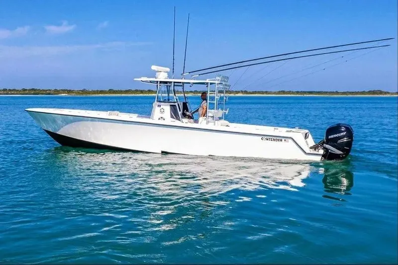 The Image of 2019 Contender 39 ST boat on calm blue water, equipped with Mercury engines. - 1