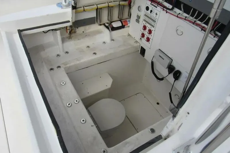 Slide: The Image of 2019 Contender 39 ST boat interior with control panel and storage area. - 11
