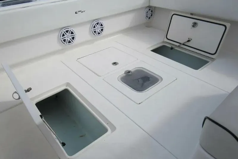 Slide: The Image of 2019 Contender 39 ST boat deck with storage compartments and speakers. - 18