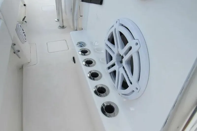Slide: The Image of 2019 Contender 39 ST boat interior with speaker and rod holders. - 9