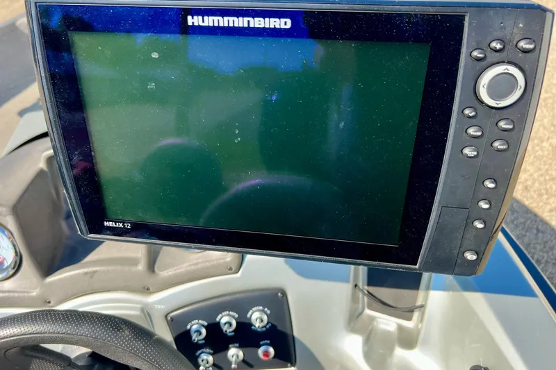 Slide: The Image of Humminbird Helix 12 fishfinder on 2017 Tracker Pro Guide V-17 SC boat dashboard. - 15