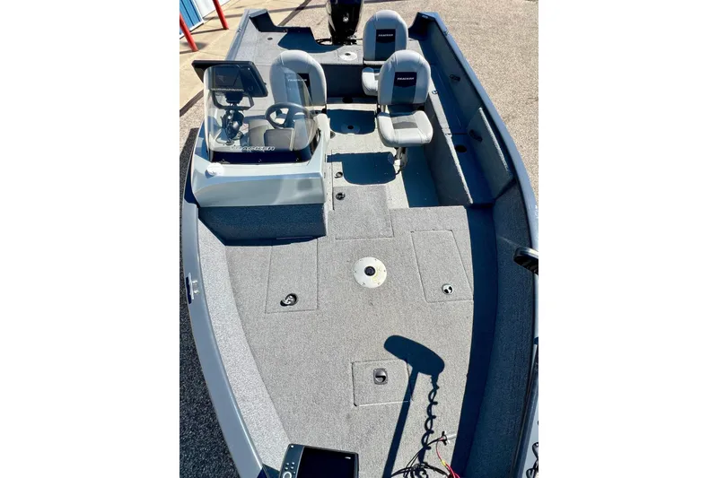 Slide: The Image of 2017 Tracker Pro Guide V-17 SC boat interior with seating and steering console. - 17