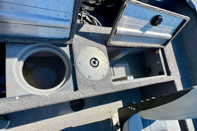 Slide: The Image of 2017 Tracker Pro Guide V-17 SC boat interior storage compartments and seating area. - 21