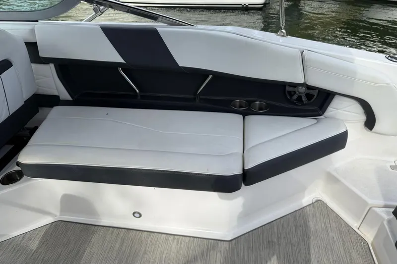 Slide: The Image of 2017 Regal 26 OBX boat interior seating with cup holders and speaker. - 19
