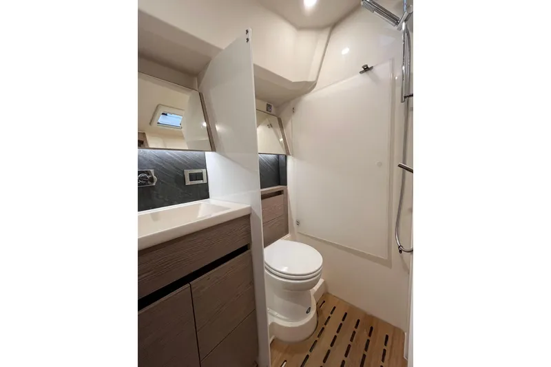 Slide: The Image of Modern bathroom in 2021 Hanse 508 yacht with sleek fixtures and wooden flooring. - 14