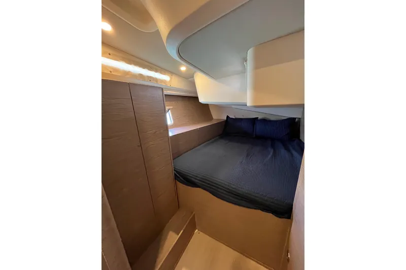Slide: The Image of Cozy cabin interior of 2021 Hanse 508 yacht with modern design and comfortable bedding. - 15
