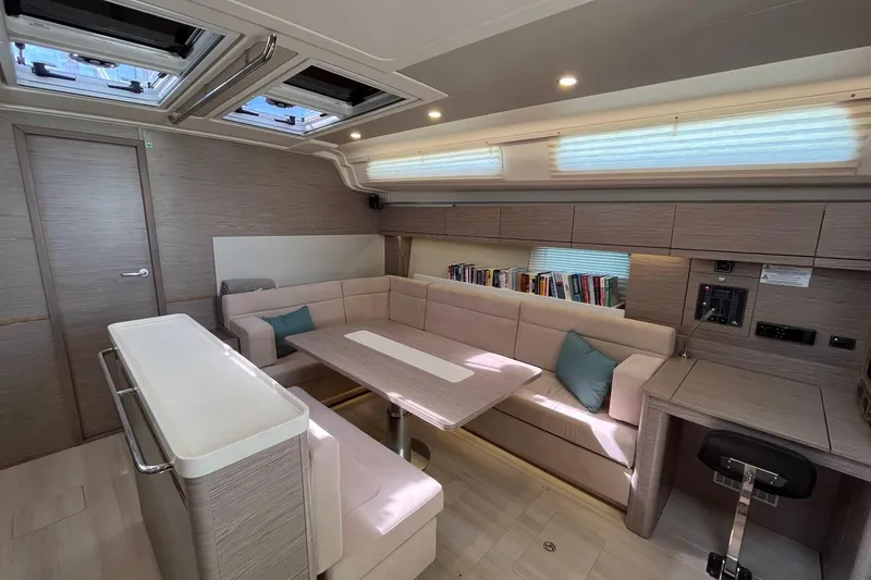 Slide: The Image of Luxurious interior of 2021 Hanse 508 yacht with modern seating and natural light. - 19