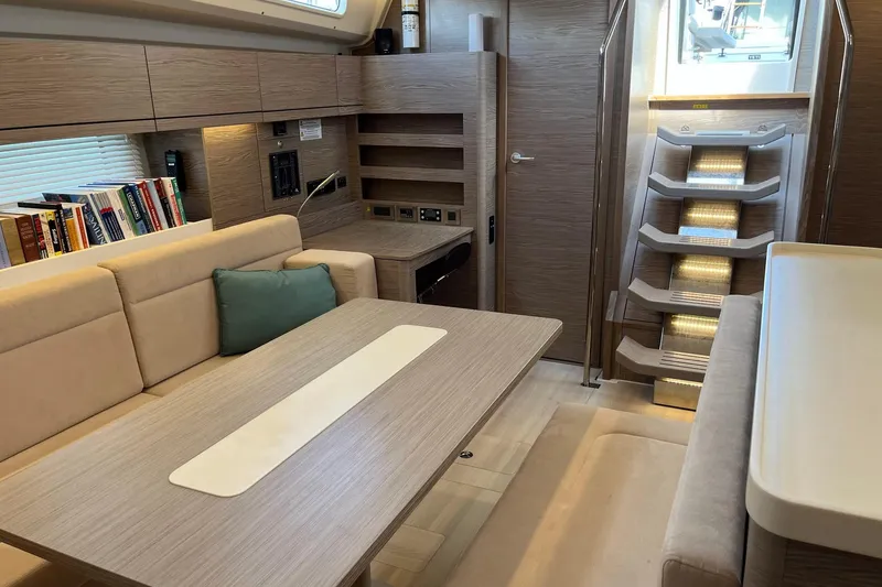 Slide: The Image of Luxurious interior of 2021 Hanse 508 yacht with modern seating and elegant wooden finishes. - 20