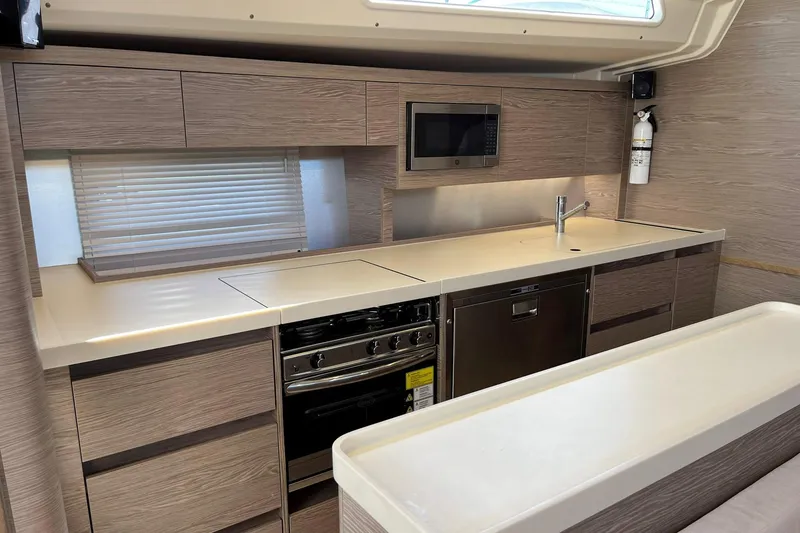 Slide: The Image of Modern kitchen interior of 2021 Hanse 508 yacht with sleek cabinetry and appliances. - 23
