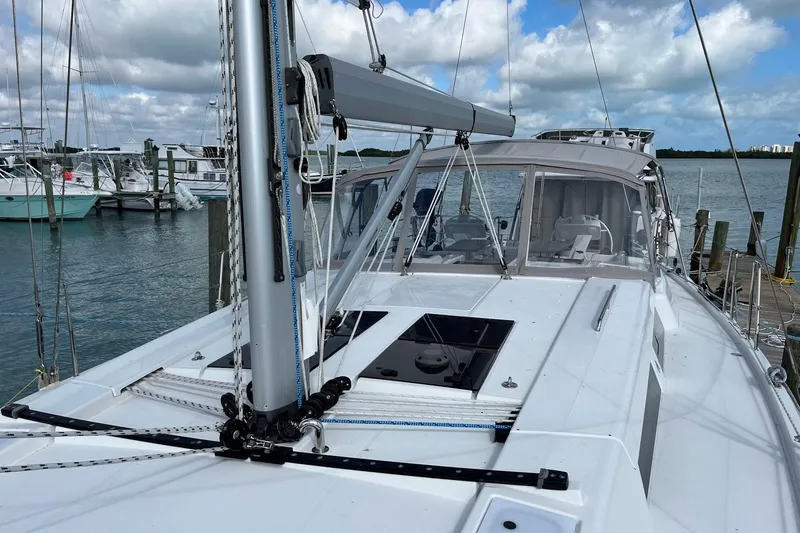 Slide: The Image of 2021 Hanse 508 yacht docked at marina under cloudy sky. - 4