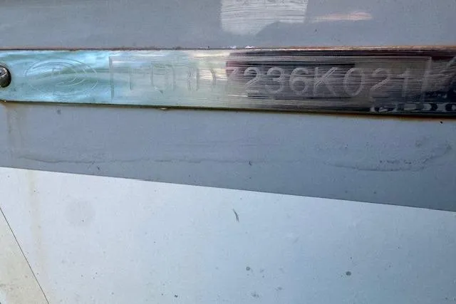 Slide: The Image of 2021 Pursuit DC 266 Dual Console boat identification number on hull. - 18