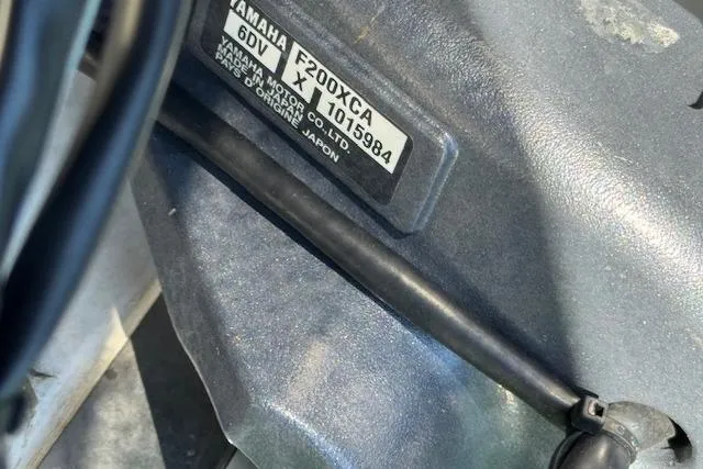 Slide: The Image of Close-up of Yamaha F200XCA engine label on 2021 Pursuit DC 266 Dual Console boat. - 19