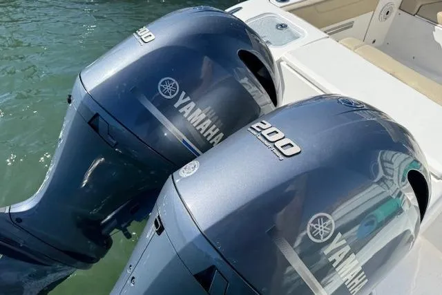 Slide: The Image of 2021 Pursuit DC 266 Dual Console with twin Yamaha 200 engines on water. - 5