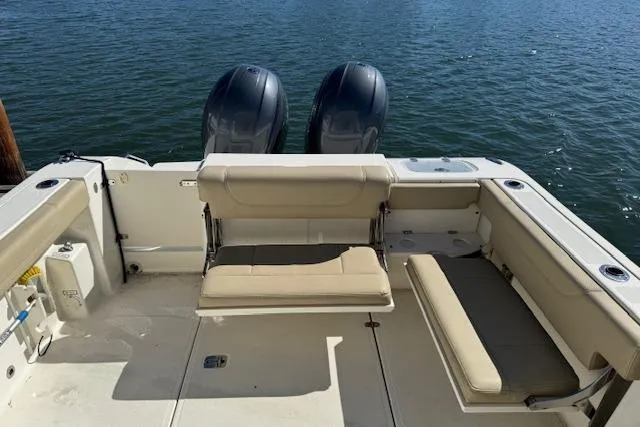 Slide: The Image of 2021 Pursuit DC 266 Dual Console boat with twin engines and spacious seating. - 7
