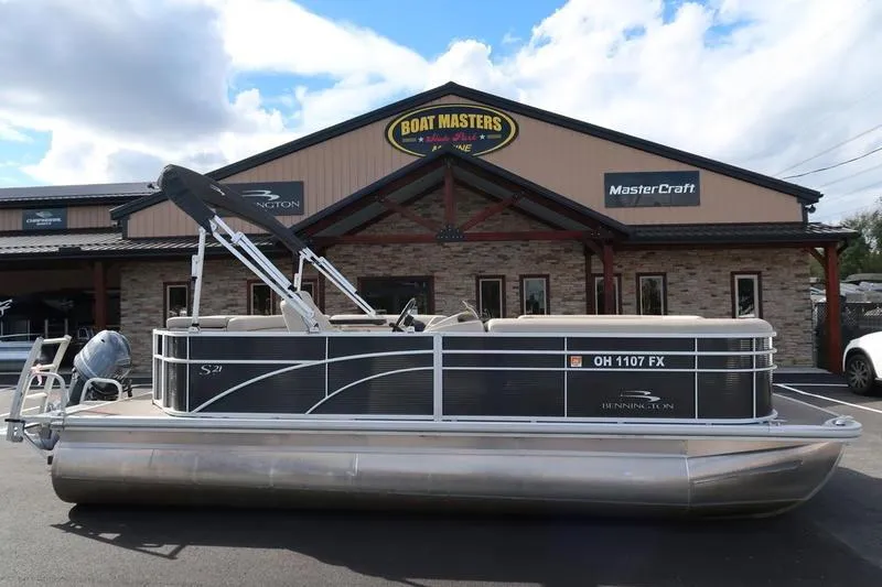 Slide: The Image of 2020 Bennington 21 SL pontoon boat parked outside Boat Masters dealership. - 1