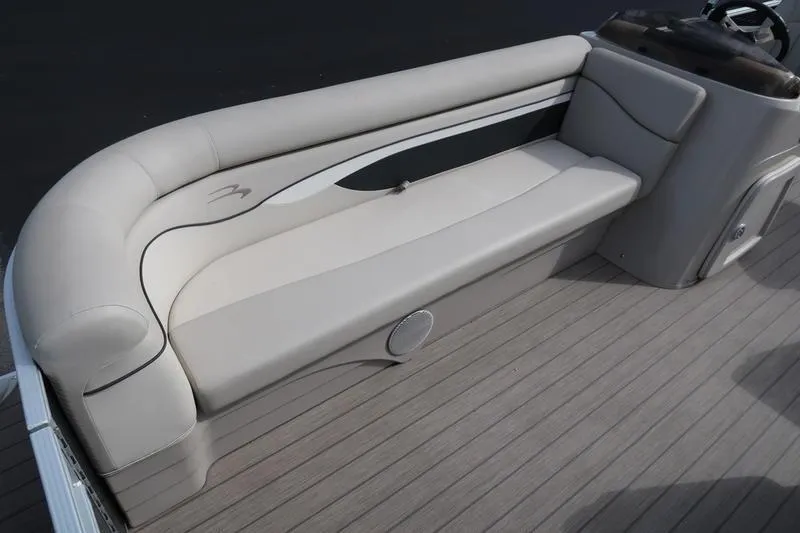 Slide: The Image of 2020 Bennington 21 SL boat interior with beige seating and sleek design. - 18