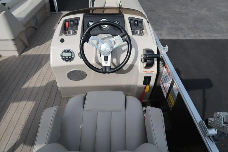 Slide: The Image of 2020 Bennington 21 SL boat helm with steering wheel and controls. - 22