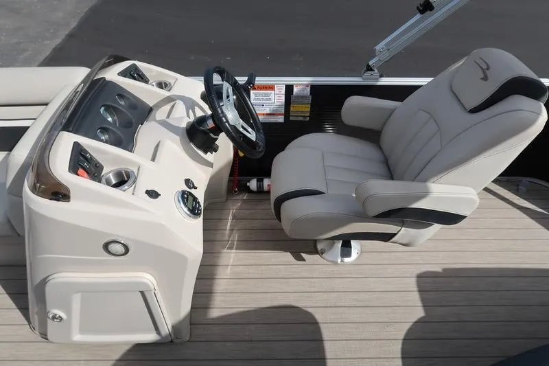 Slide: The Image of Captain's chair and helm of 2020 Bennington 21 SL pontoon boat. - 25