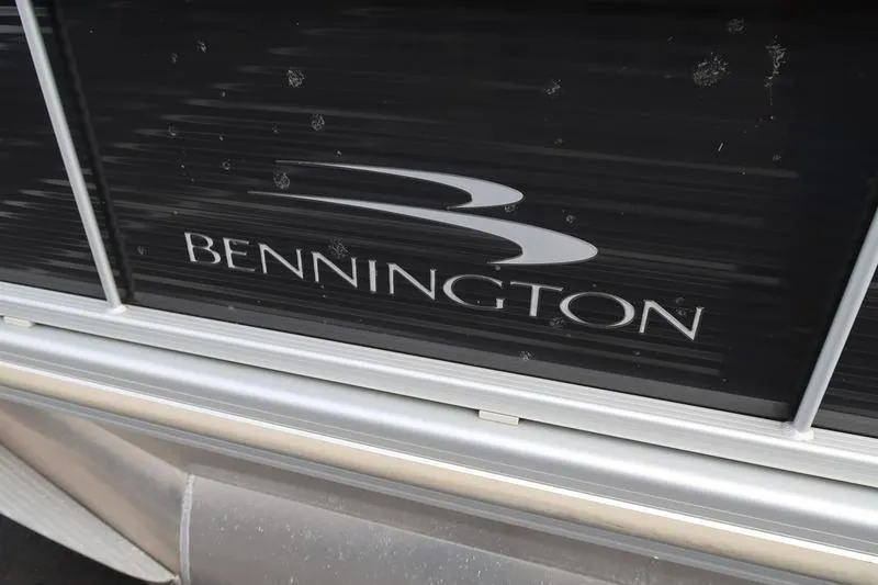 Slide: The Image of 2020 Bennington 21 SL boat logo on black panel. - 3