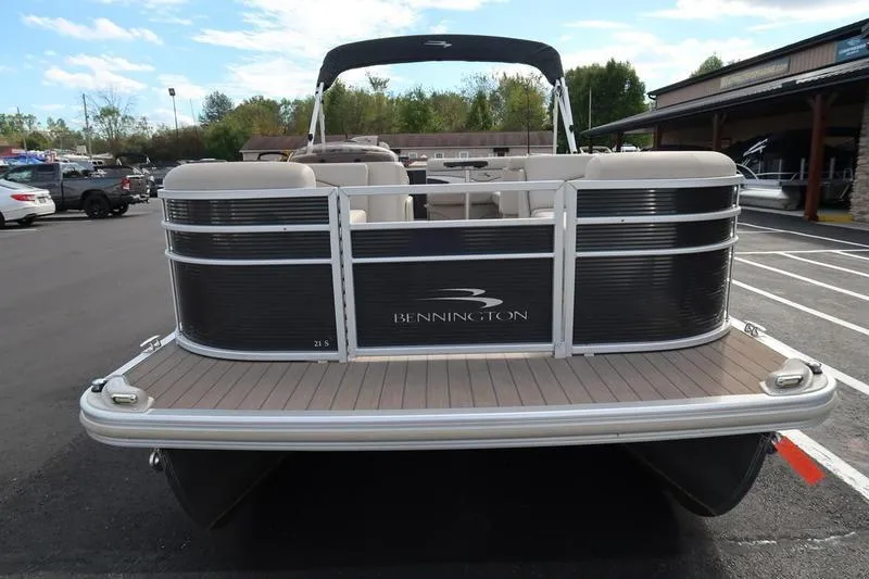 Slide: The Image of 2020 Bennington 21 SL pontoon boat in a parking lot, rear view. - 6