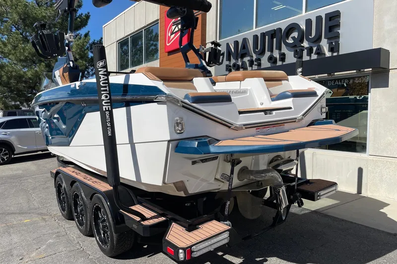Slide: The Image of 2021 Nautique Super Air Nautique G23 boat on trailer at dealership. - 3
