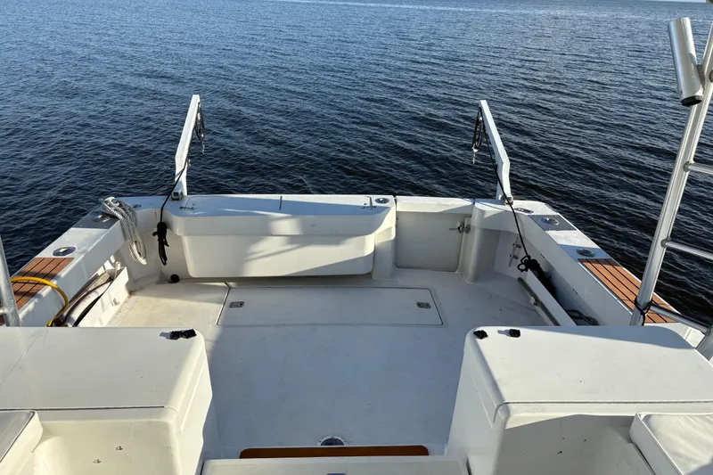 Slide: The Image of 1995 Luhrs Open Express boat deck overlooking calm water. - 24