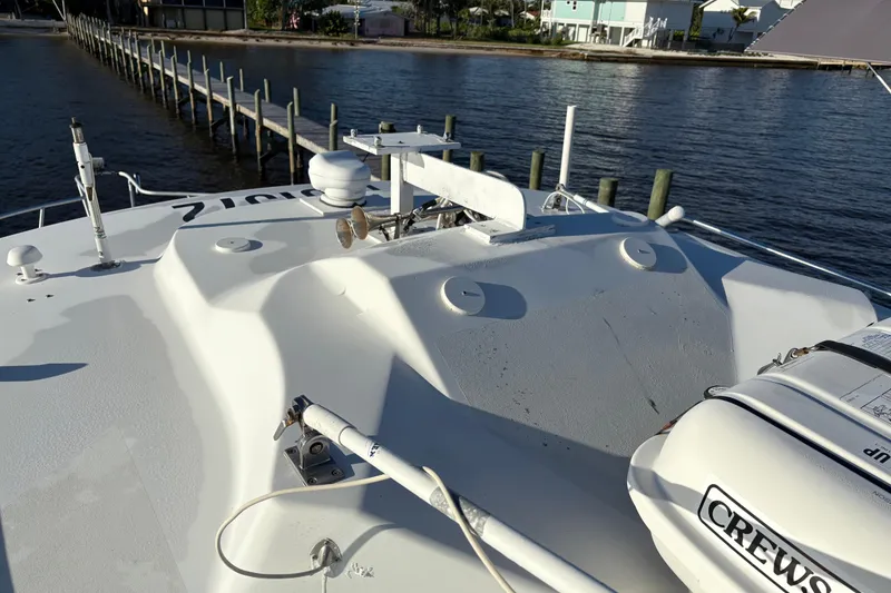 Slide: The Image of 1995 Luhrs Open Express boat deck with equipment, dock, and waterfront view. - 3