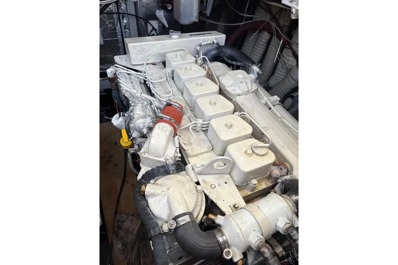 Slide: The Image of Engine of a 1995 Luhrs Open Express boat, showcasing detailed mechanical components. - 41