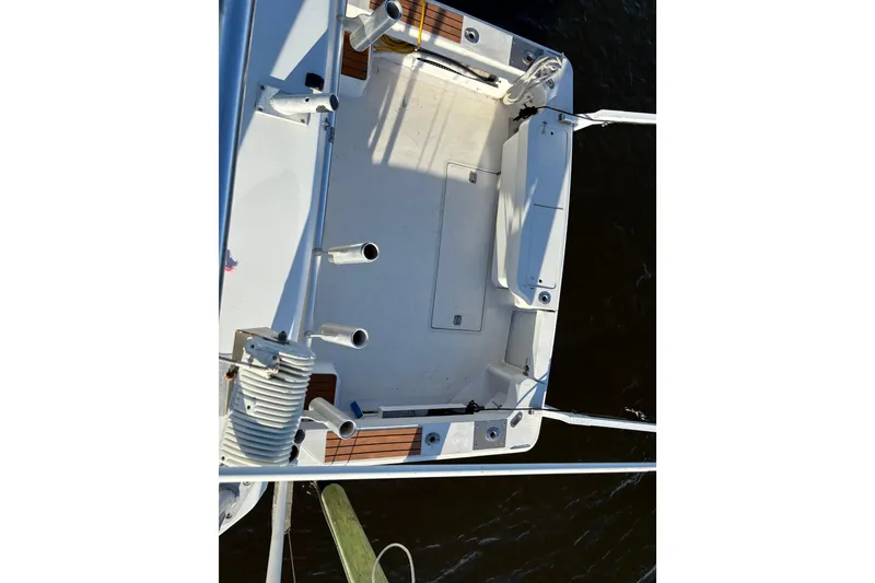 Slide: The Image of 1995 Luhrs Open Express boat deck, aerial view, featuring fishing rod holders and seating. - 39