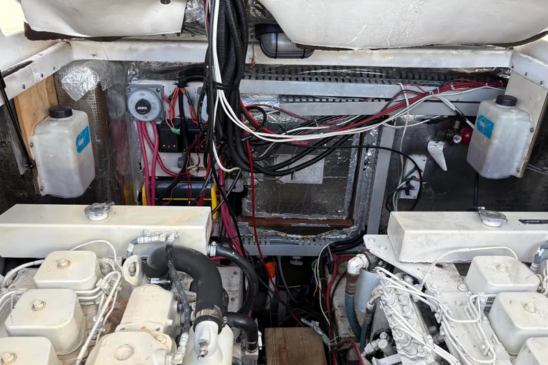 Slide: The Image of Engine room of a 1995 Luhrs Open Express boat, showing wiring and components. - 43