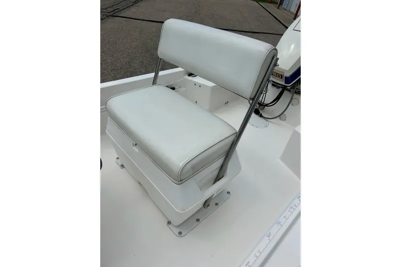 Slide: The Image of 1997 Wellcraft 160 Fisherman boat interior with storage compartments and rod holders. - 11