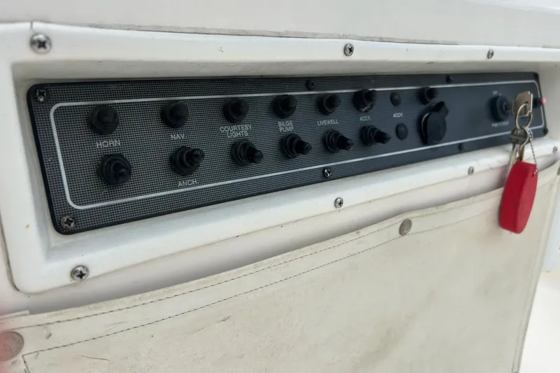 Slide: The Image of Open storage compartment on 1997 Wellcraft 160 Fisherman boat, showcasing interior space. - 13