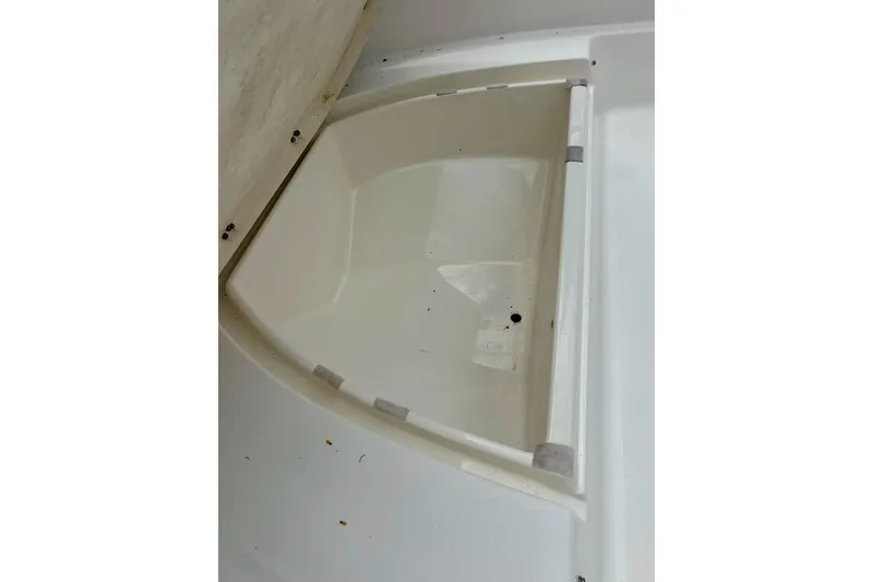 Slide: The Image of 1997 Wellcraft 160 Fisherman boat interior with rod holders and fire extinguisher. - 17